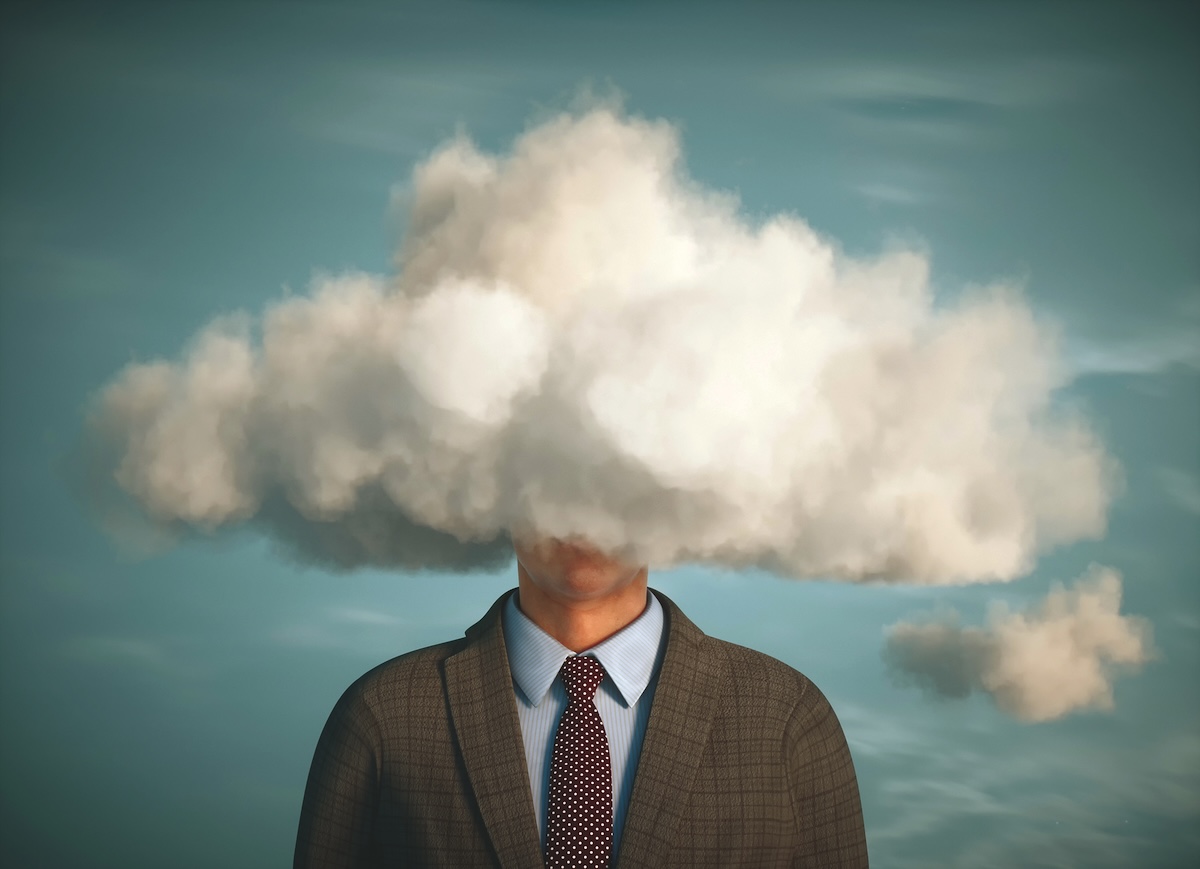 A manager in a suit and tie with his head obscured by a large cloud.